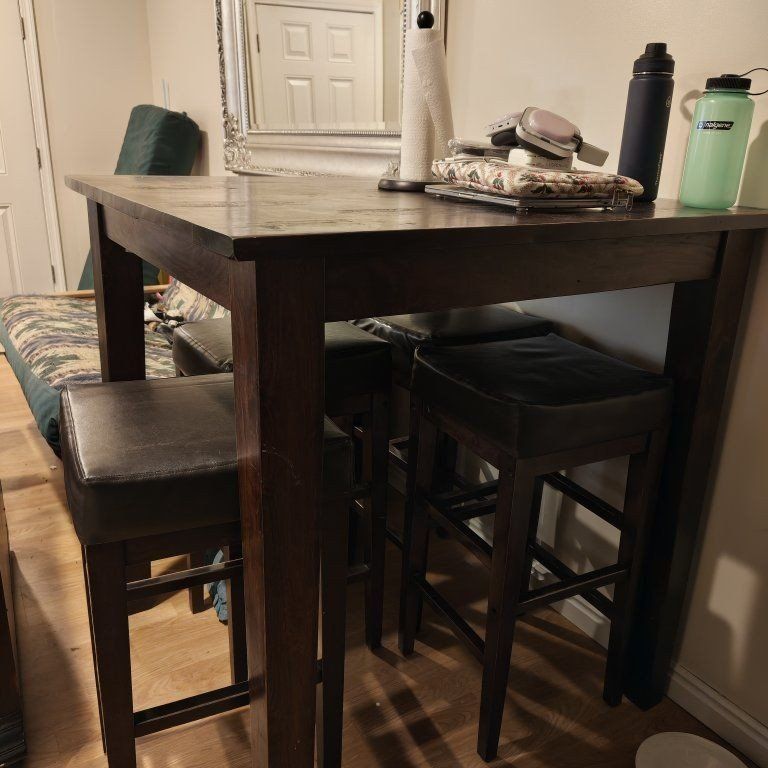 bar height dining table with stools