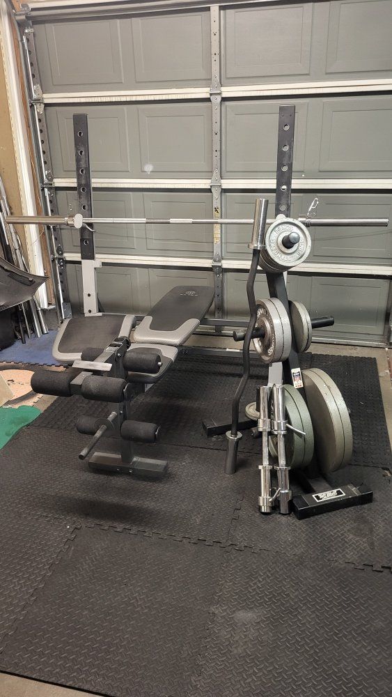 weight bench, 275 pounds of weights