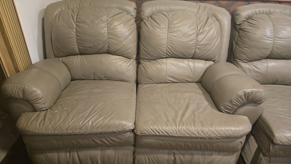 Recliner leather couch and chair.