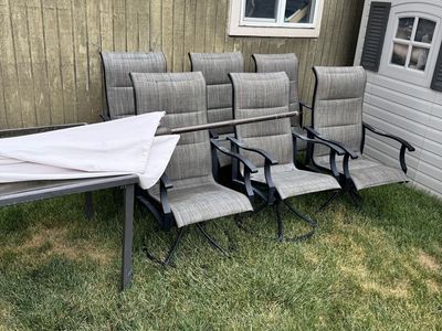 8-piece patio dining set- glass table, 6 swivel chairs & umbrella