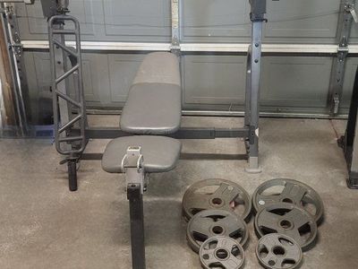 Bench and 130 pounds of weights