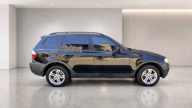 2004 BMW X3 3.0i — rebuilt & branded title, 16% below market