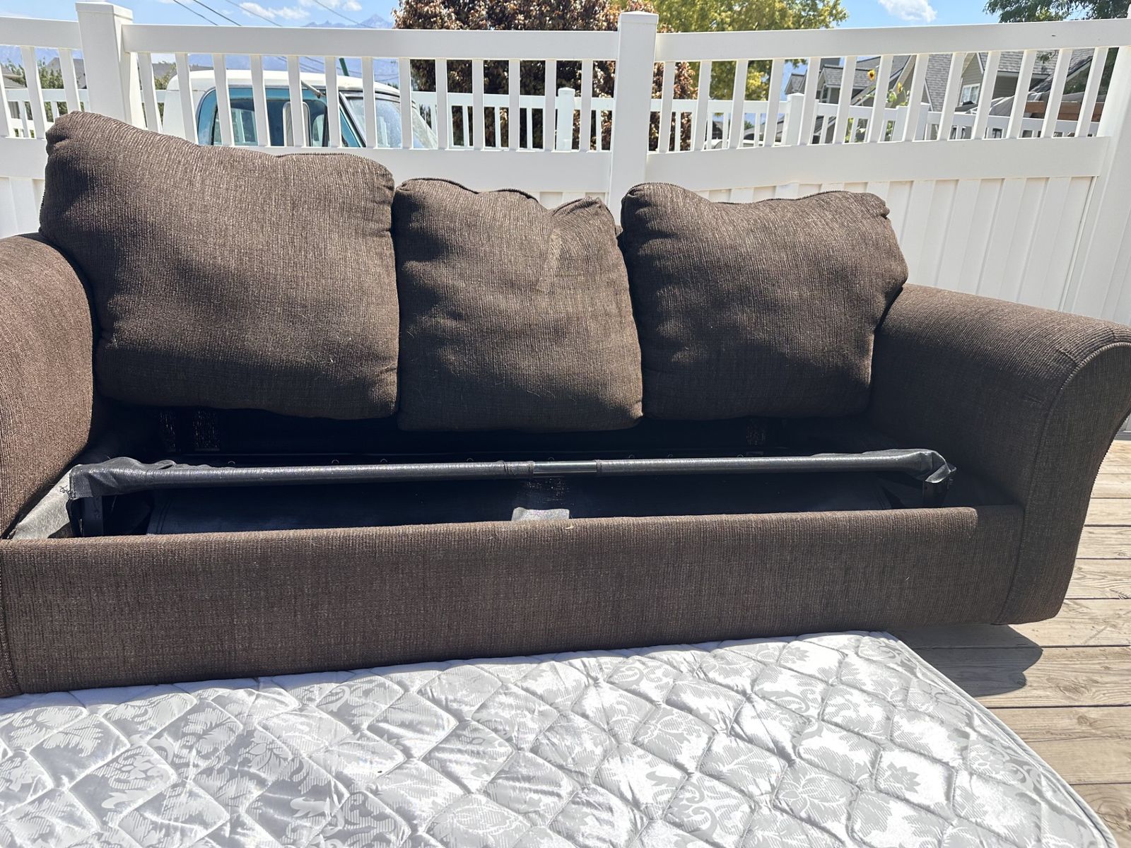 Dark Brown Couch w/ pullout mattress.