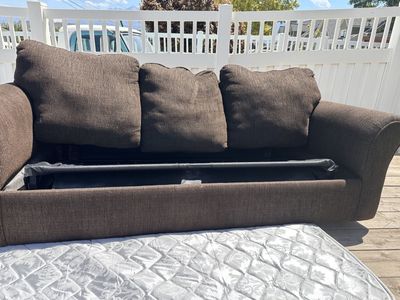 Dark Brown Couch w/ pullout mattress.