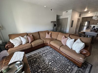 Large Brown Sectional Sofa with Fabric and Leather Trim