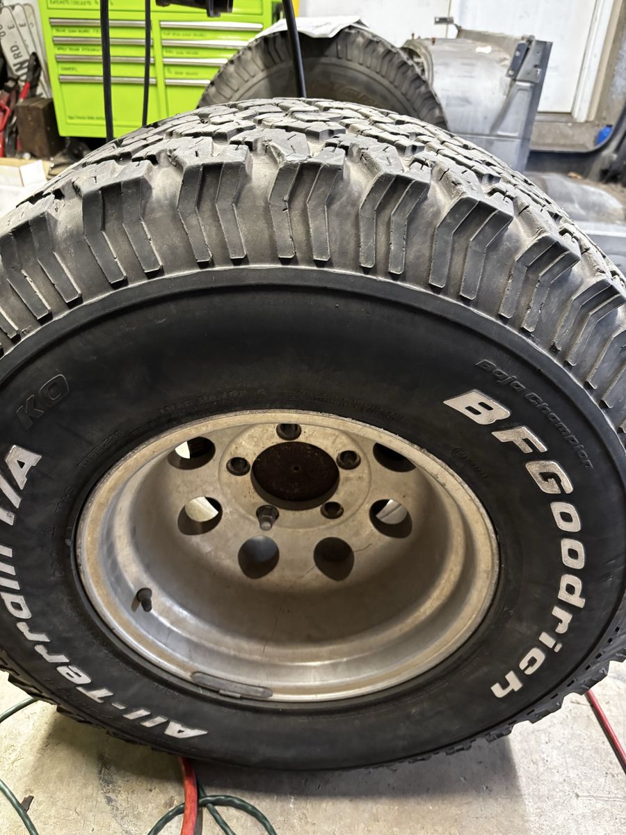 SET OF 4 : 15X10 5 on 5.5” Aluminum Wheels with old BFGoodrich All Terrain 33x12.50R15 Tires.