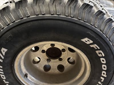 SET OF 4 : 15X10 5 on 5.5” Aluminum Wheels with old BFGoodrich All Terrain 33x12.50R15 Tires.
