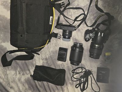 Nikon 1 J1 with 10-30 mm lens and Nikon D-40x with two lens