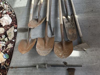 Lot of Garden Hand Tools; 5 Shovels, Hoe, Two Axes, Milk Crates Pull Hook, All Have Wood Handles & In Fair Condition