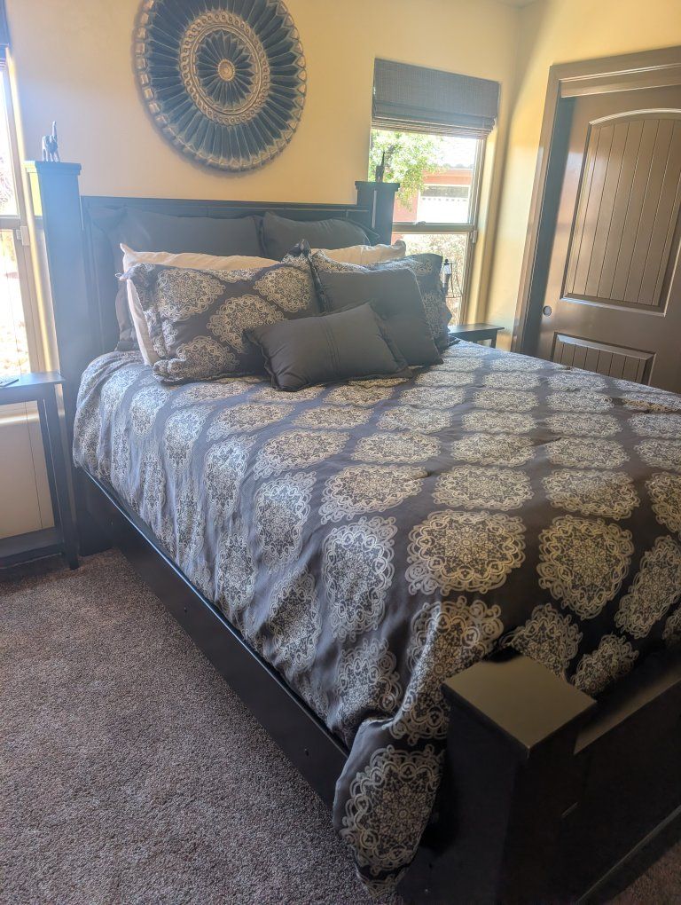 Beautiful Queen Size Four large square posts, black, with Like new clean mattress set in Lehi.