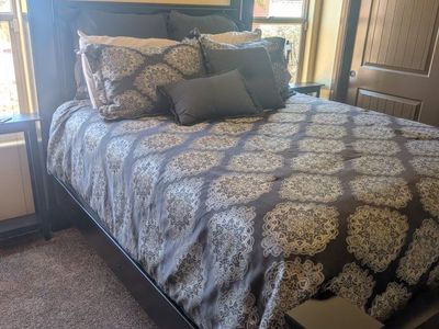 Beautiful Queen Size Four large square posts, black, with Like new clean mattress set in Lehi.