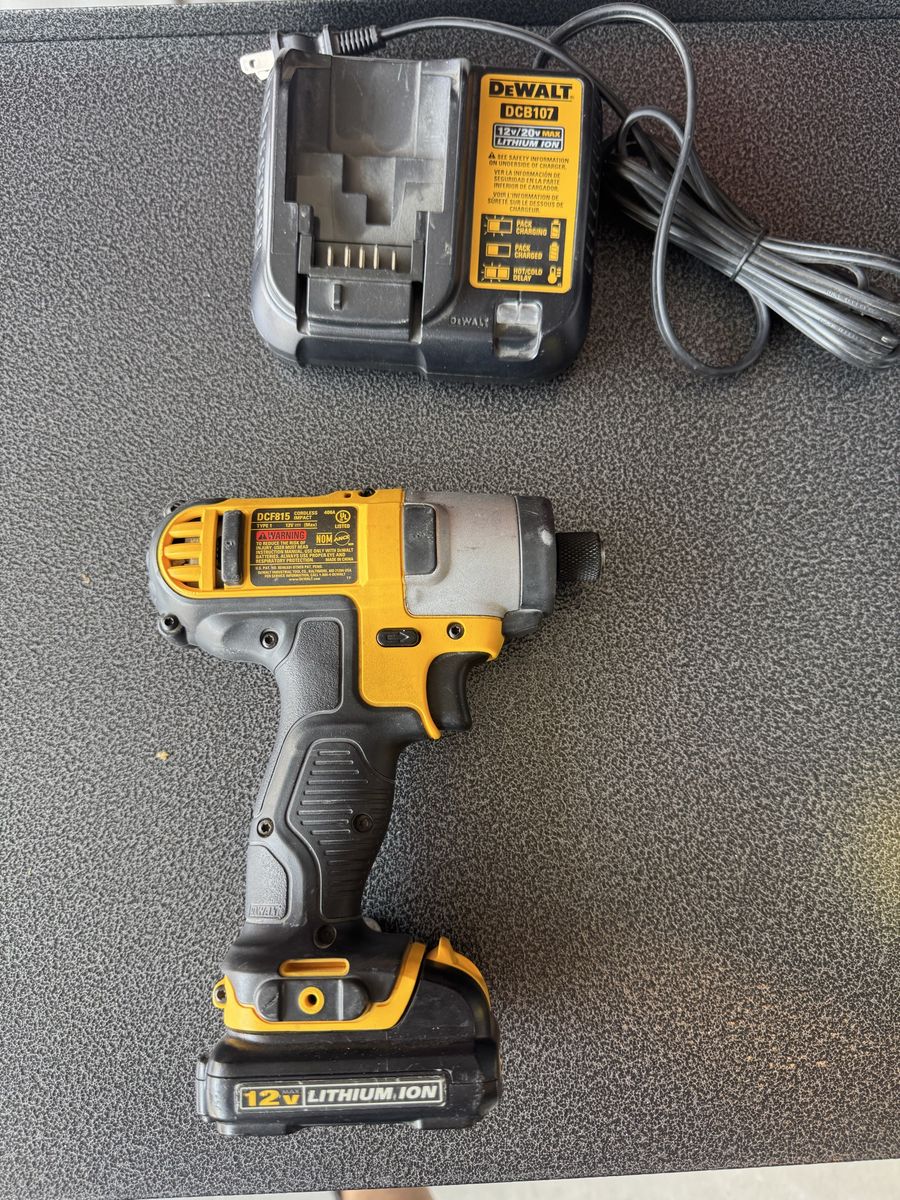 DEWALT 12V MAX Cordless Impact Driver (DCF815) with Battery and Charger. Works great no problems 