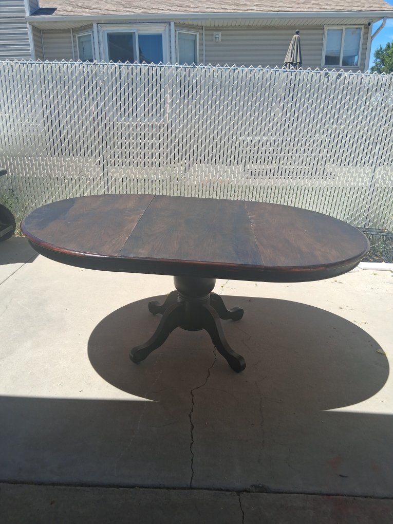 Round to Oval Dark Wood Dining Table with Pedestal Base - Extendable