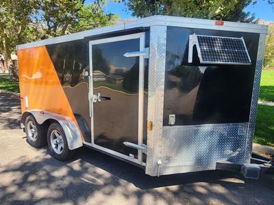2013 Cargo Craft 6'8" wide X 15' long V-NOSE Enclosed Cargo Trailer. Complete set up for Hauling And Storing 2 Large Motorcycles