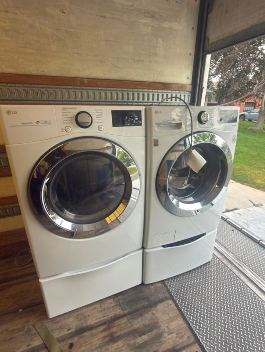 Beautiful LG Front Load Washer and Electric Dryer with Pedestals