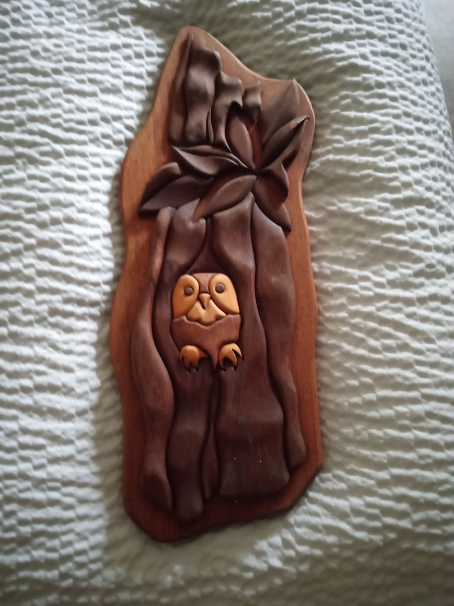 Folk art vintage wood owl in a tree