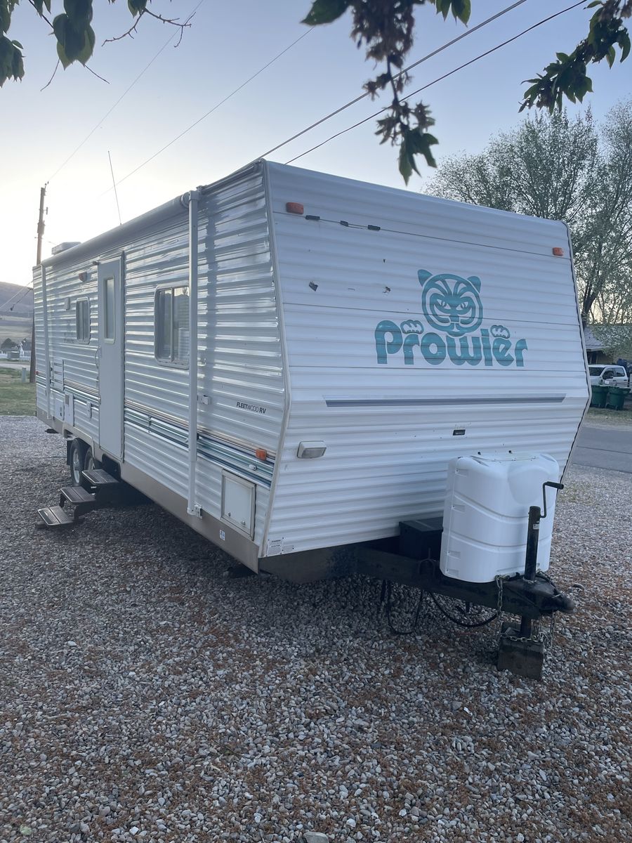 2003 Prowler Camp Trailer w/12’ slide