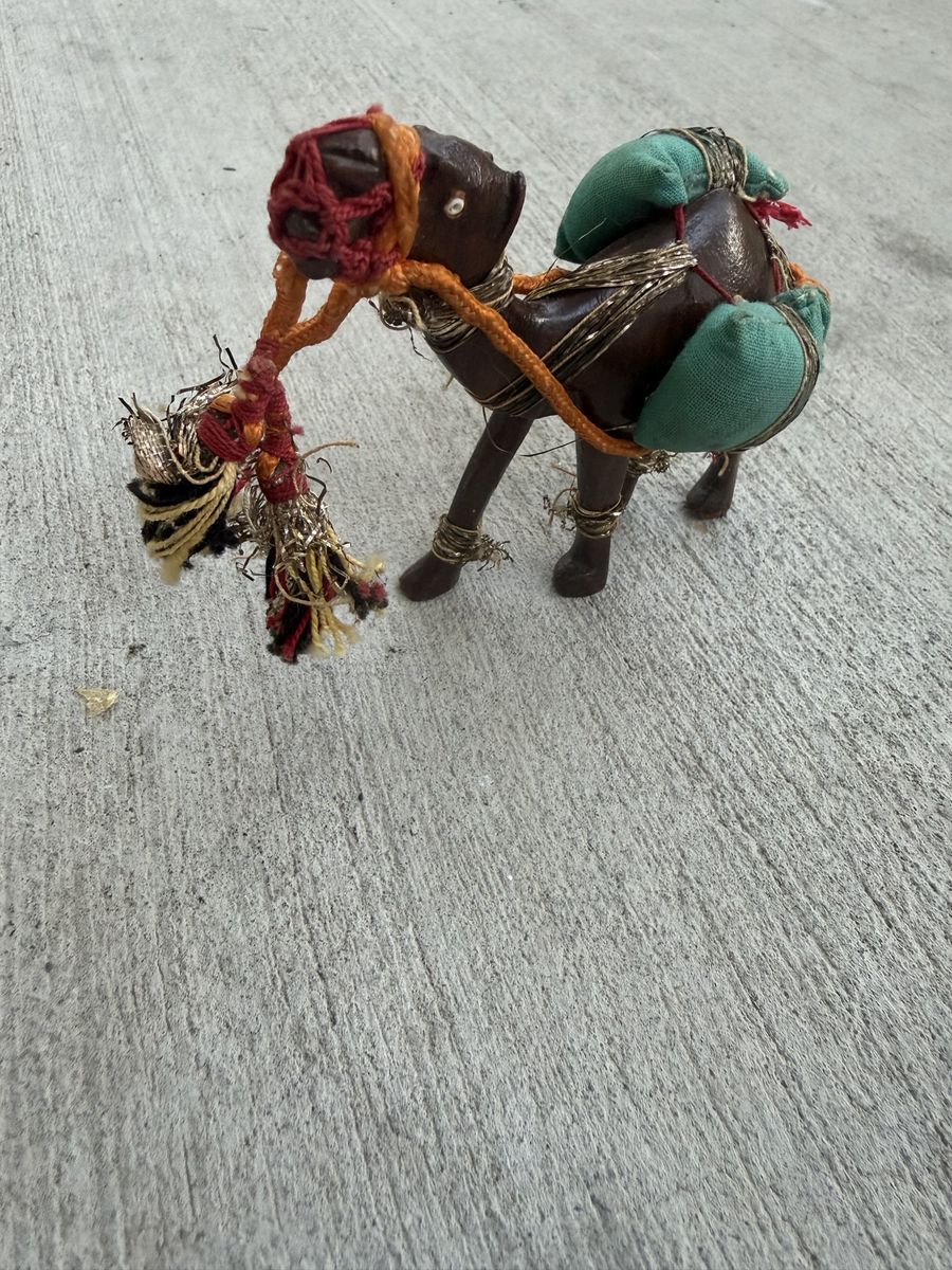 Vintage Handcrafted Leather and Wood Camel Figurine with Saddle Packs and Tassels