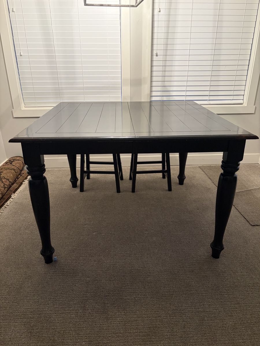 Black Wooden Dining Table with Slatted Top and Turned Legs