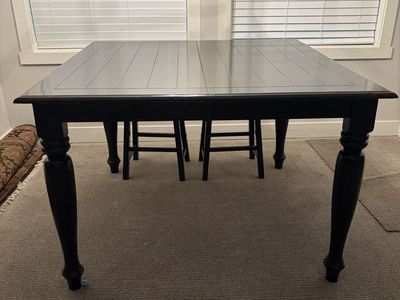 Black Wooden Dining Table with Slatted Top and Turned Legs