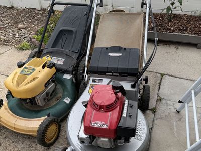 Honda and yard man lawnmowers