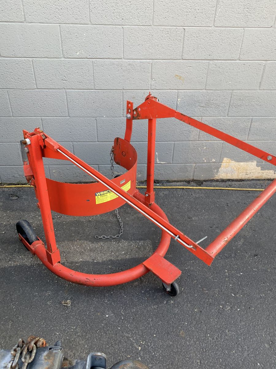 Wesco 55 gallon barrel movers.  Plus, controlled dumping into buckets or your needs