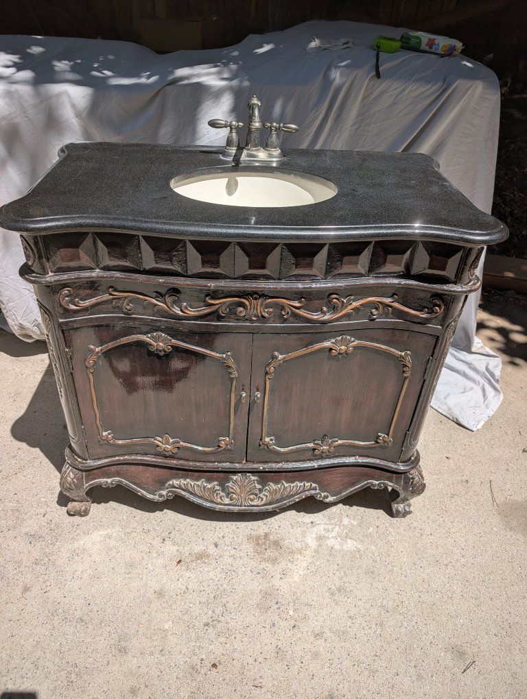 Elegant Bathroom Vanity with Immaculate Black Granite Top