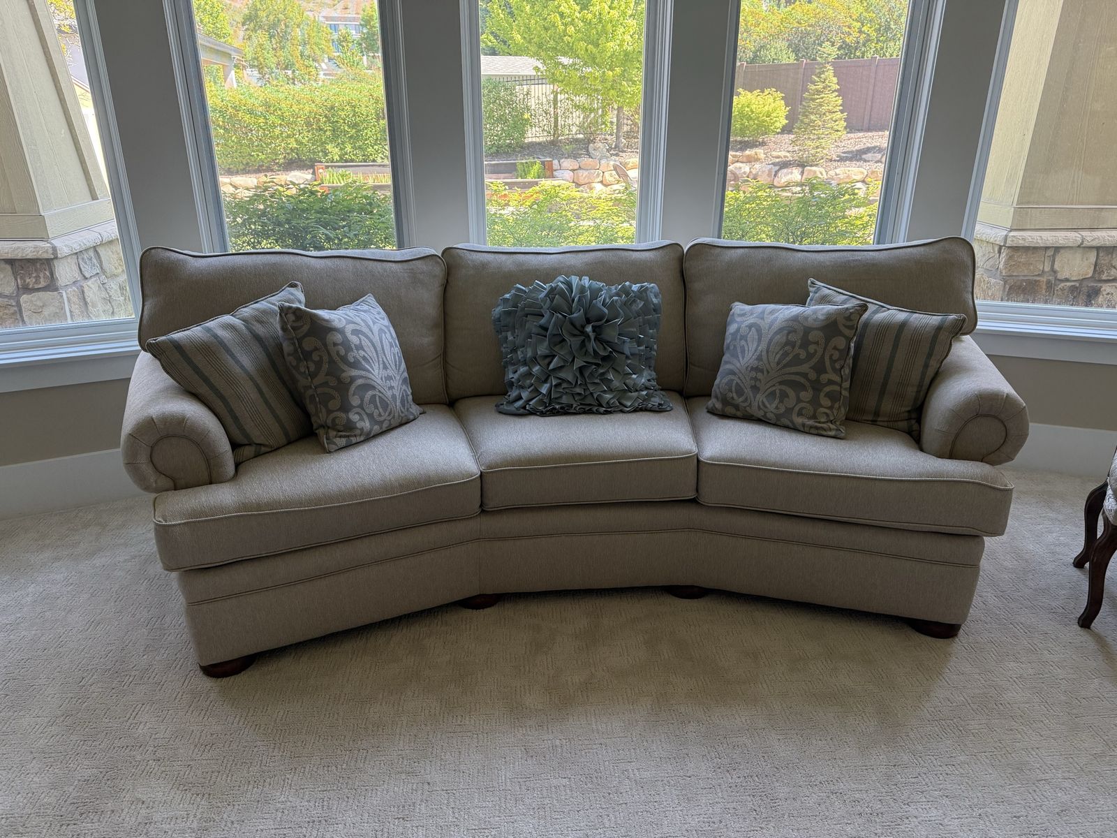 8’ curved custom beige sofa - perfect for a bay window