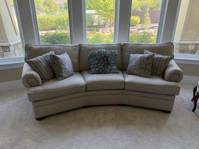8’ curved custom beige sofa - perfect for a bay window