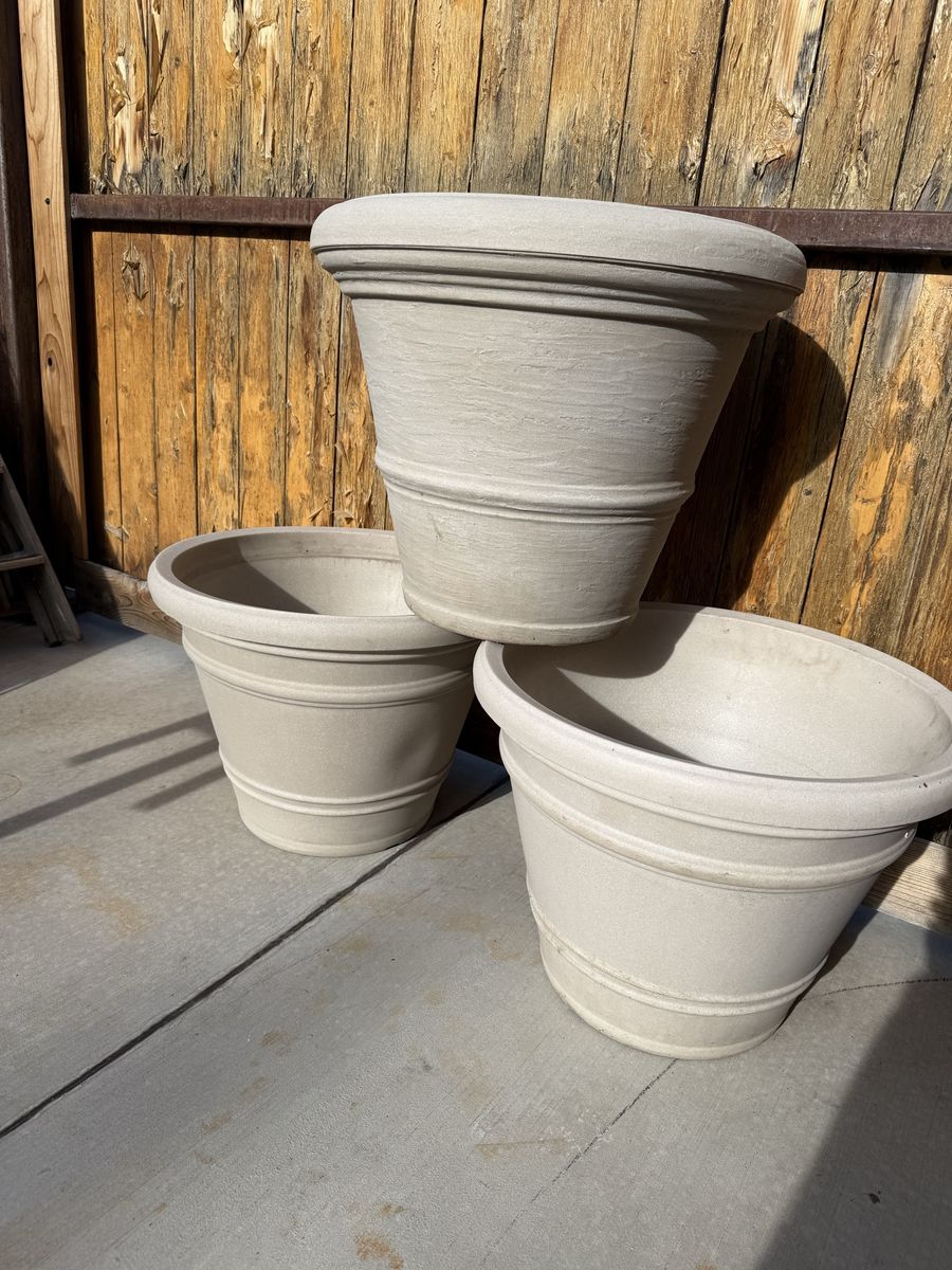 Large beige planter pots 18” tall by 24” wide $30 each resin material