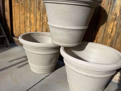Large beige planter pots 18” tall by 24” wide $30 each resin material