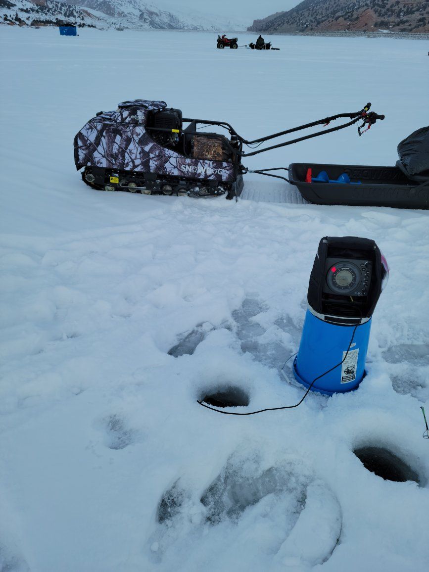 Snowdog Camo Sport Utility Machine with Sled and Ice Fishing Gear