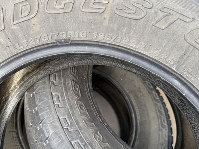 Bridgestone Dueler A/T Revo LT275/70R18 125/122R M+S All-Terrain Tires (Set of 4)