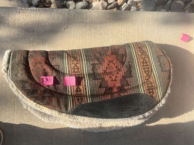For sale, sheepskin style saddle pads in good condition with some wear.