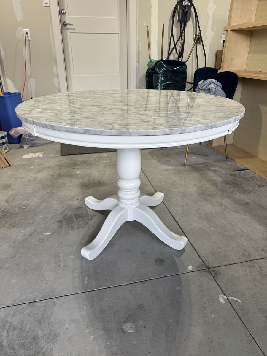 42” faux white marble round dining table.