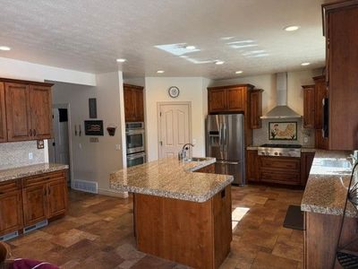Alder Kitchen Cabinets, Granite Countertops & Stainless Appliances