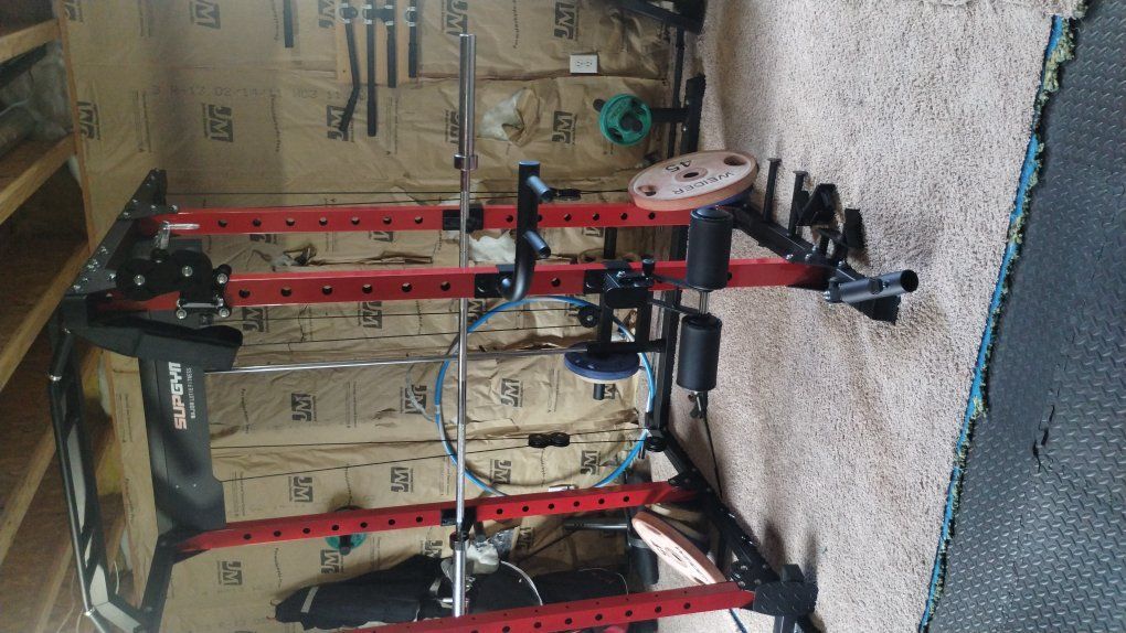 bench/ squat rack with adjustable pulleys