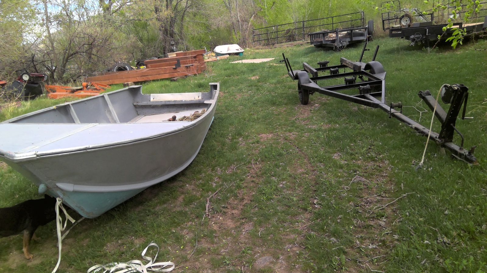 old aluminum boat and trailer