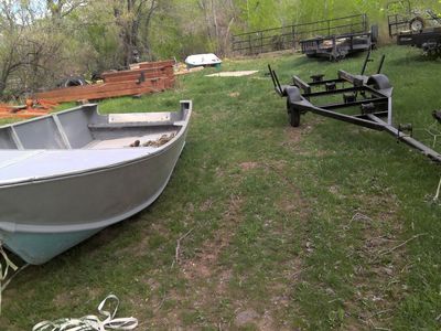 old aluminum boat and trailer