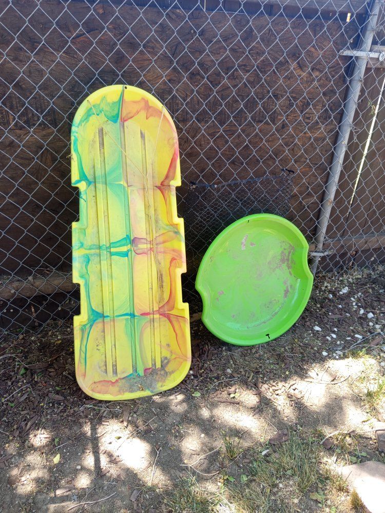 Pair of Used Plastic Sleds