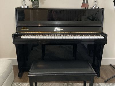 Shiny black piano with original finish