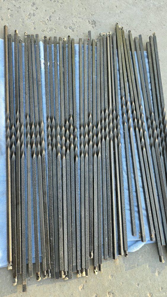 single twist iron balusters for stairs 37in x 1/2 dark brown powder coating