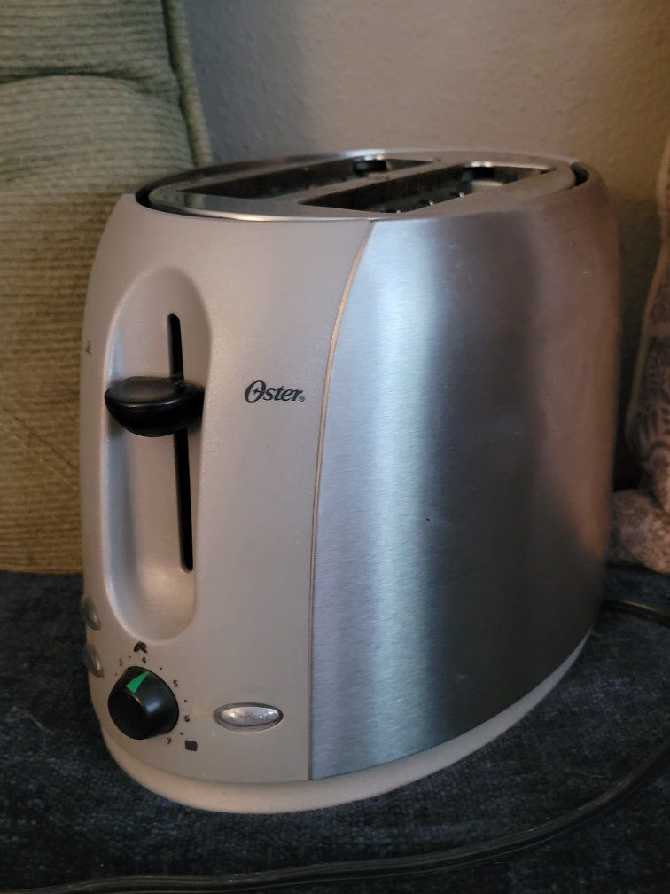 Oster TOASTER , Bagel and frozen features. silver tone
