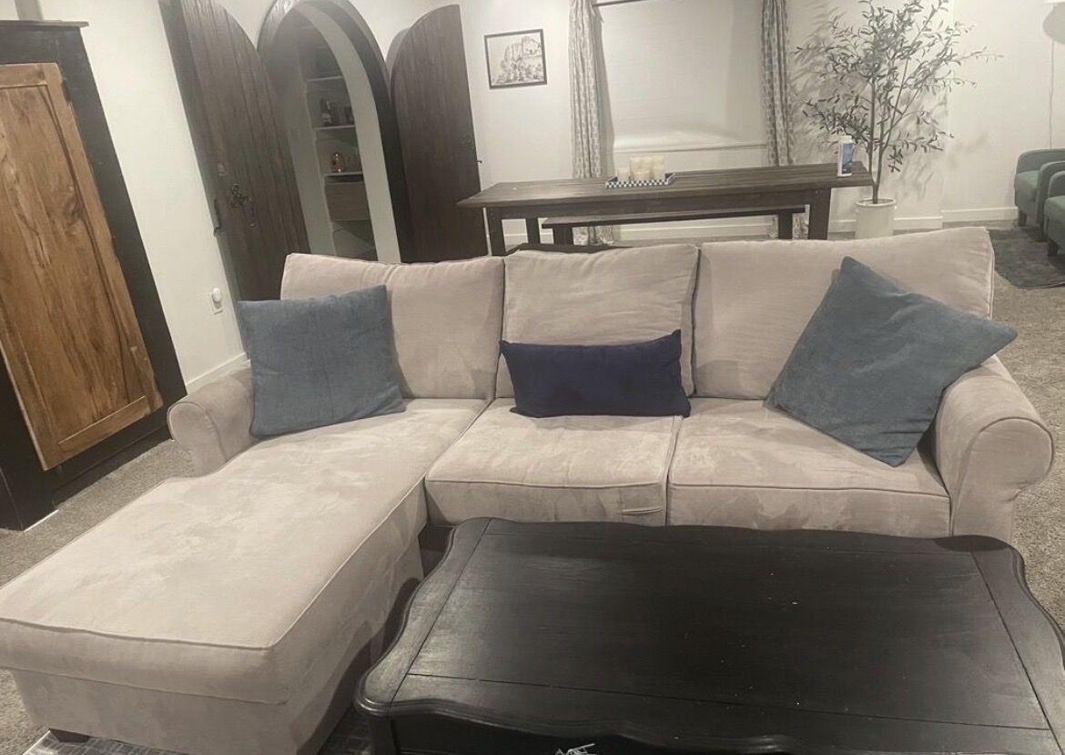 8 foot light gray couch with ottoman