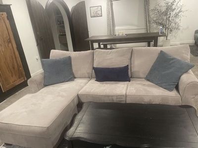8 foot light gray couch with ottoman