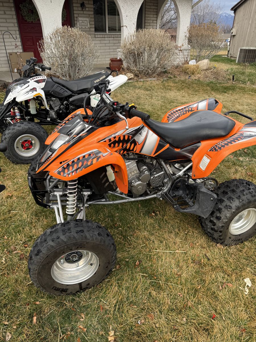 Two Atvs Predator 500 Kfx400
