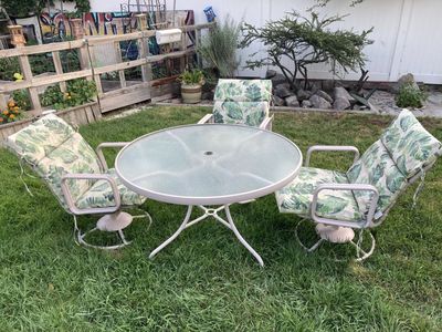 Metal Patio Dining Set w/ 3 Swivel Chairs & Round Glass Tabletop - Two Cushion Styles (Reversible)
