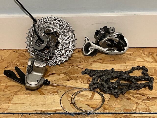 Shimano 9 speed mountain bike group set shifter derailleur.