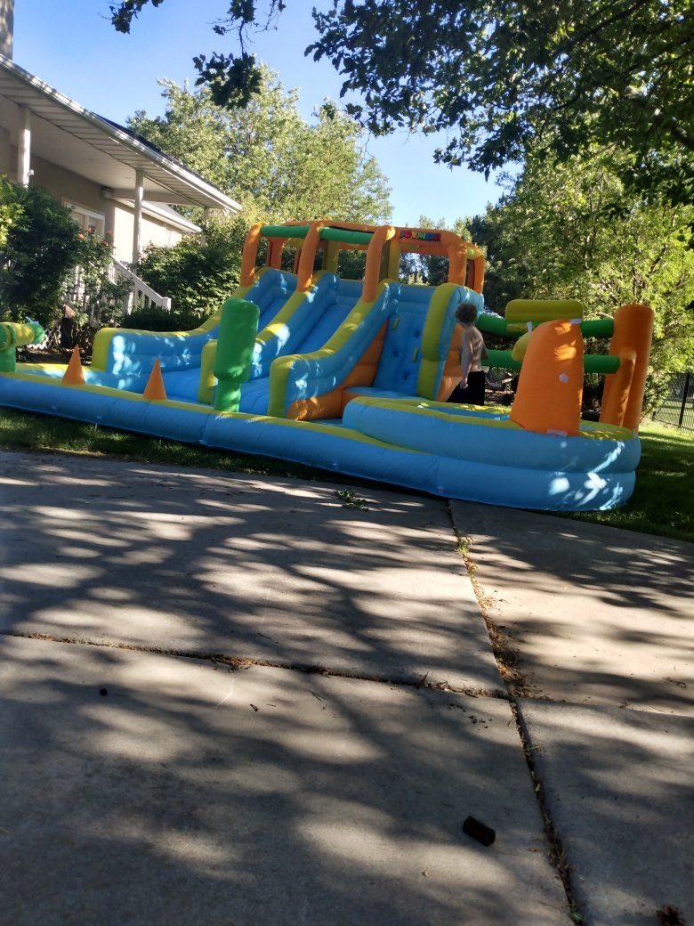 Joymore bounce house water slide with climbing wall and bb hoops