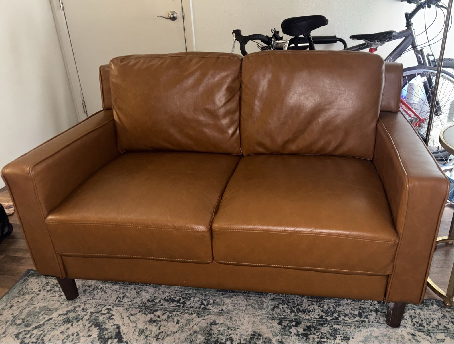 Faux leather loveseat (camel colored)